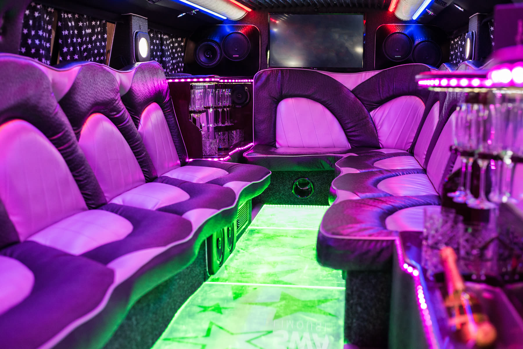 Party bus interior with LED lighting and lounge seating